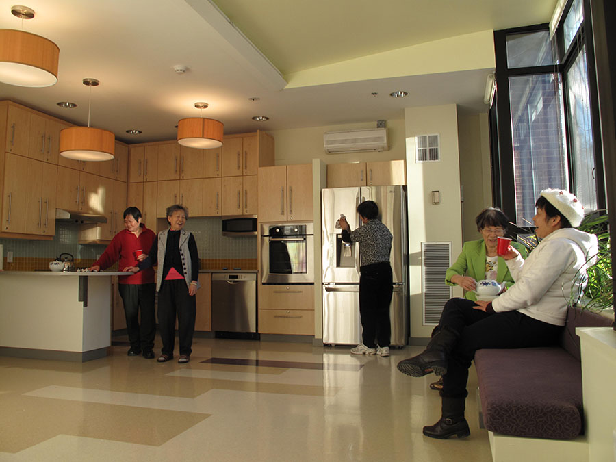 Seniors having a good time in their new kitchen.