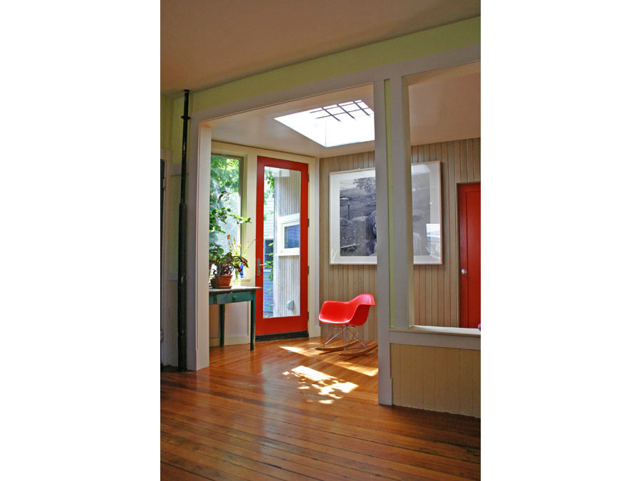 Home design brings natural light into the sunny playroom and entryway in the Cambridgeport house.