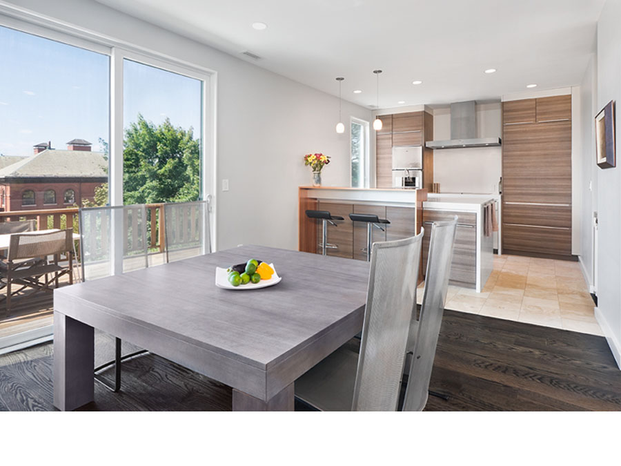 Home architecture creates an open dining and kitchen area in the Somerville house.