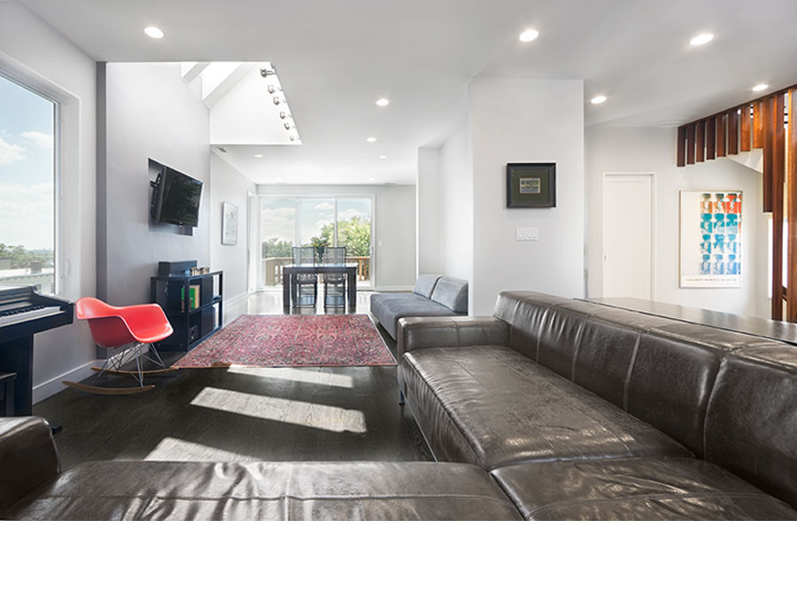 Green renovation creates a natural light filled living room in the Somerville house.