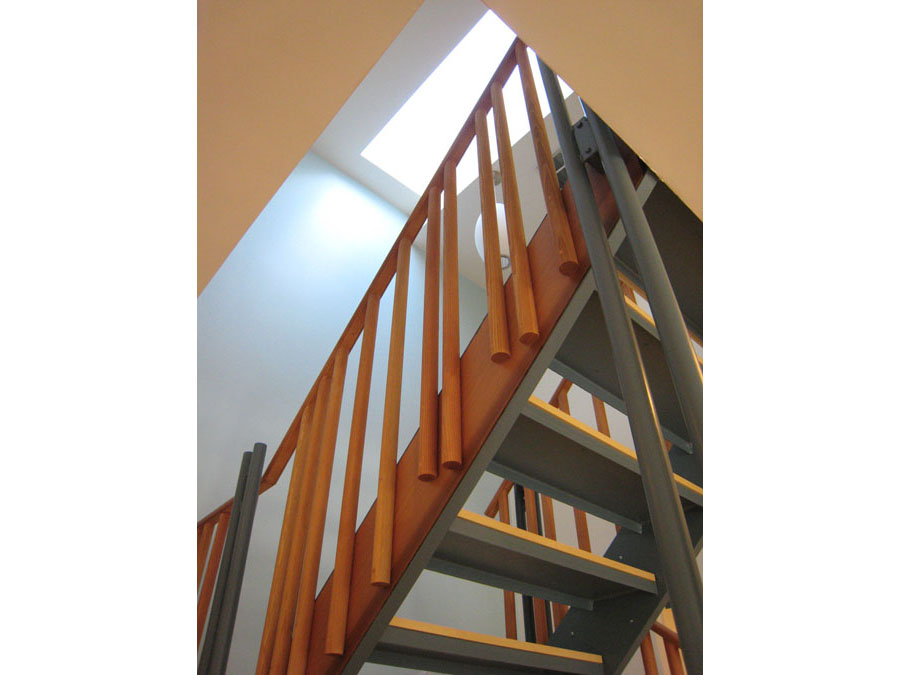 Stairs under a skylight in the Holworthy home renovation.