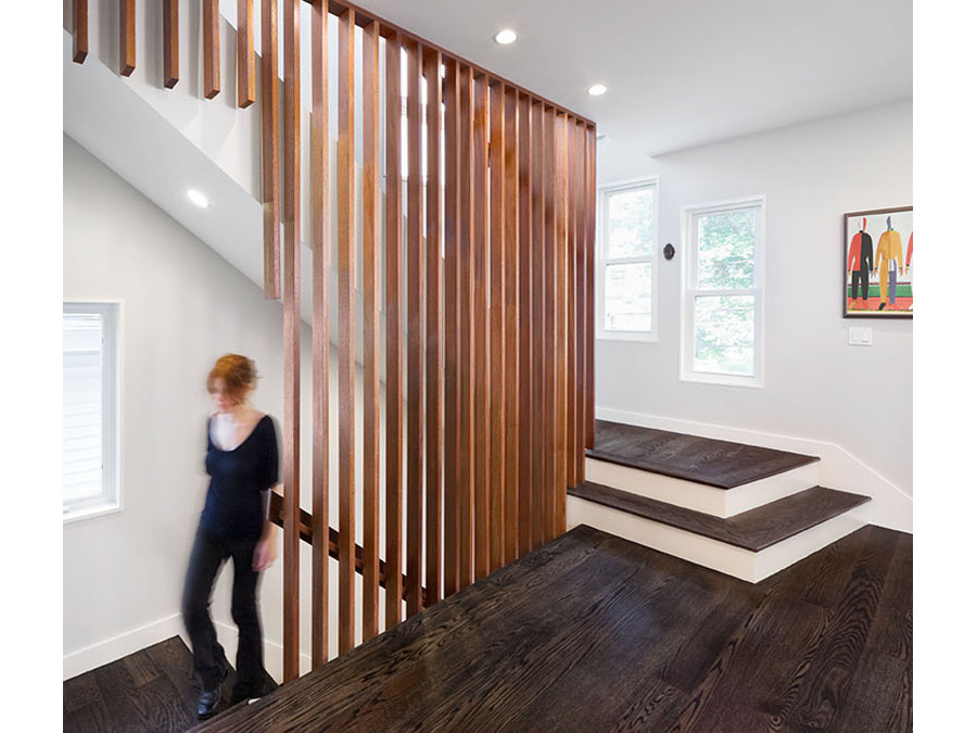 Screened stairs and dark floors in this home renovation.