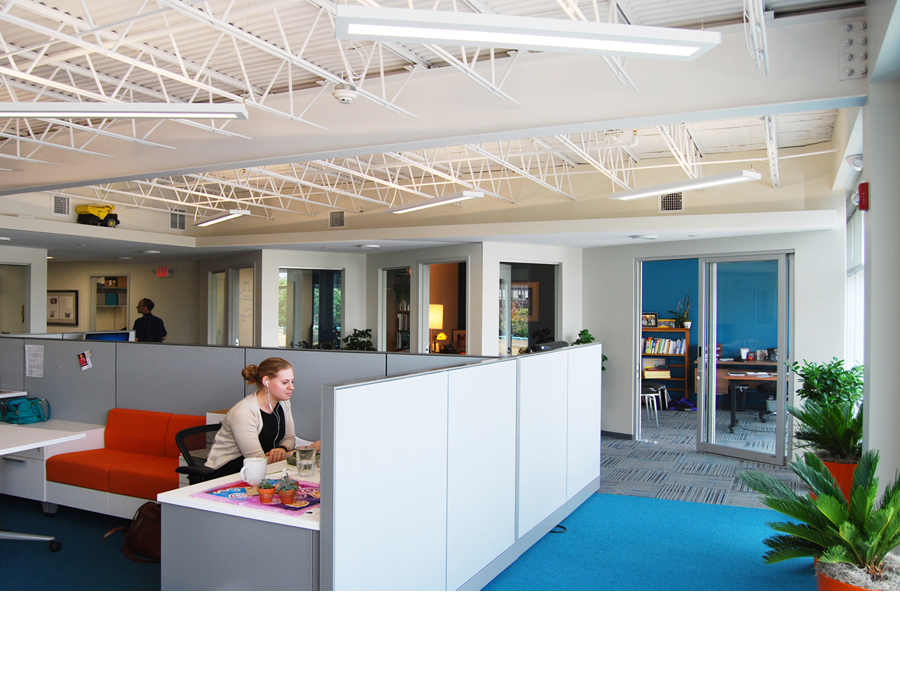 The collaborative work area in the sustainable office design for the Public Conversations Project.